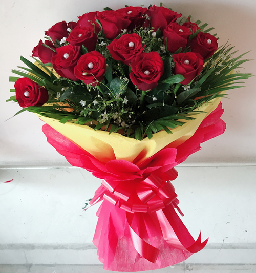 Bunch of 30 Red Rose in Red & Yellow Paper Packing delivery in Patna