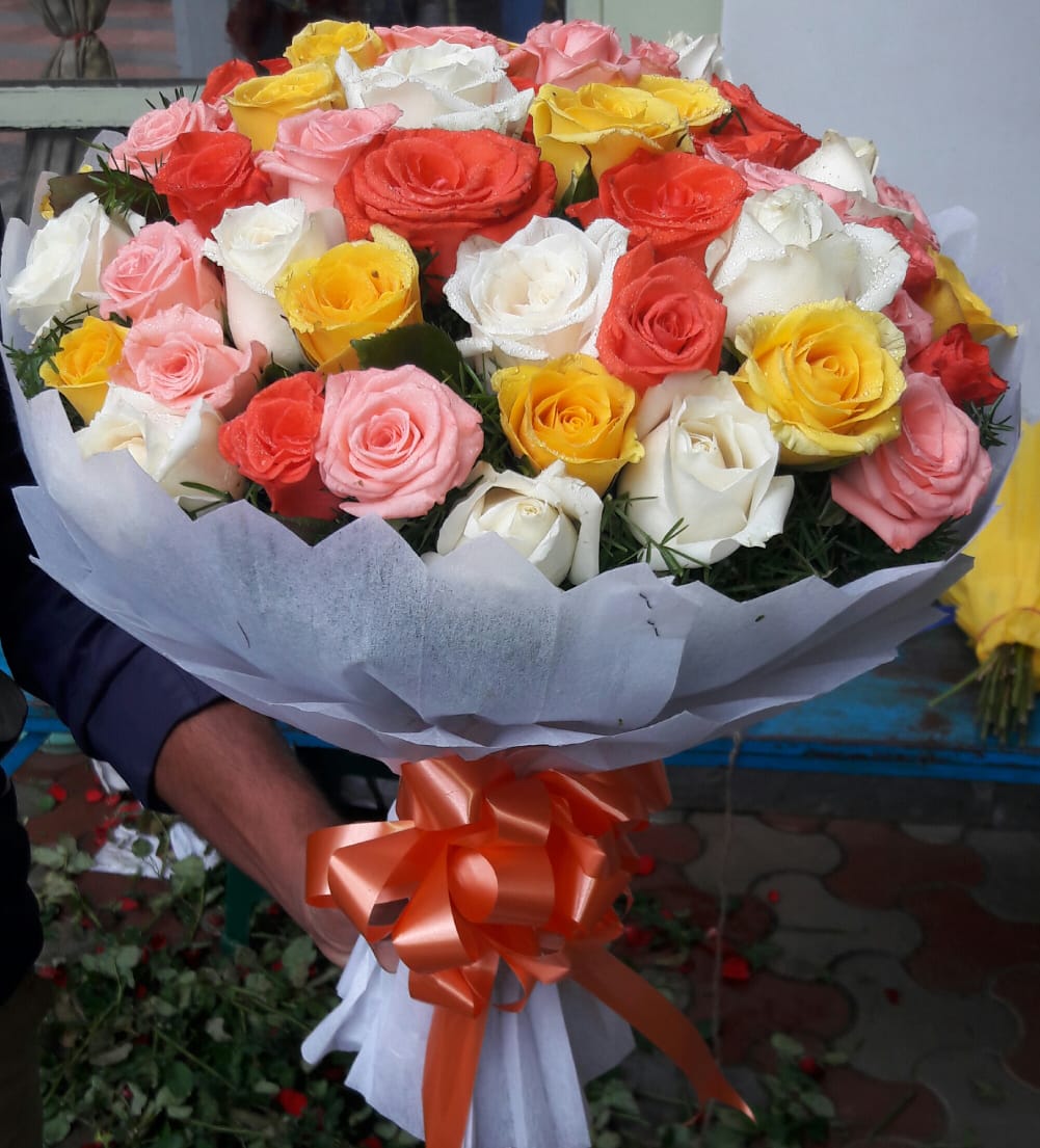 Mix Roses in White Tissue  delivery in Patna
